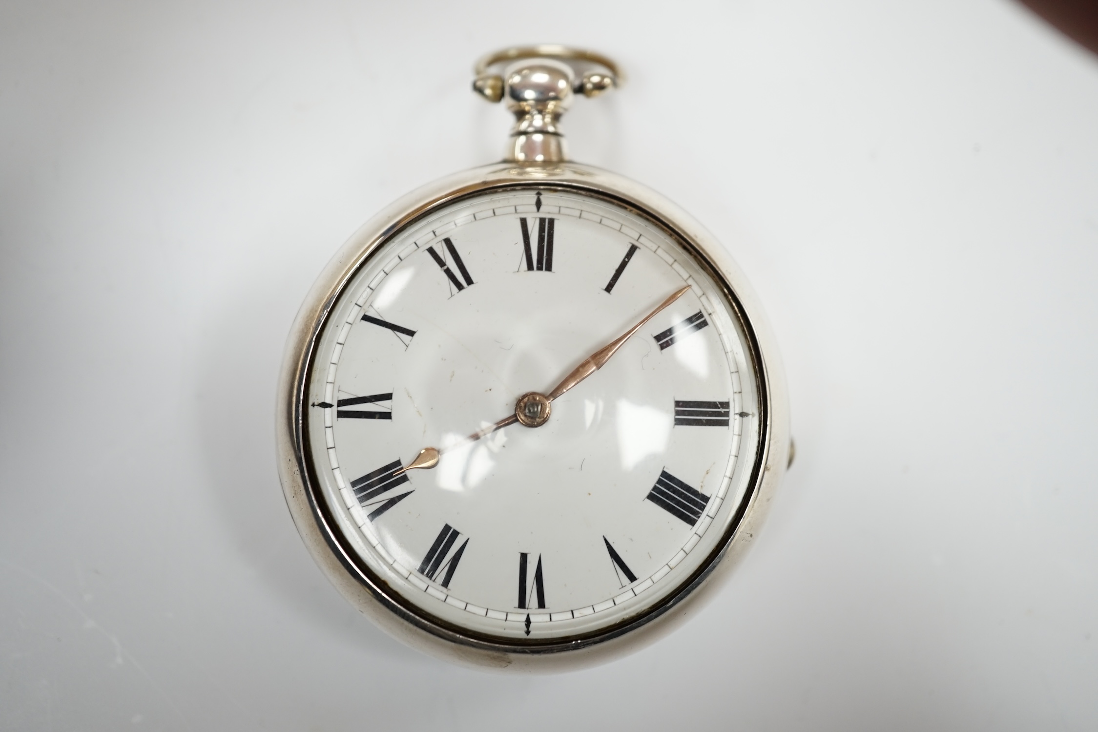 A George III silver pair cased keywind verge pocket watch, by W, Atwood of Lewes, with Roman dial and signed movement numbered 4644, outer case diameter 56mm.